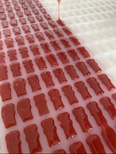 gummy-bear-mold-filled-with-red-gummies