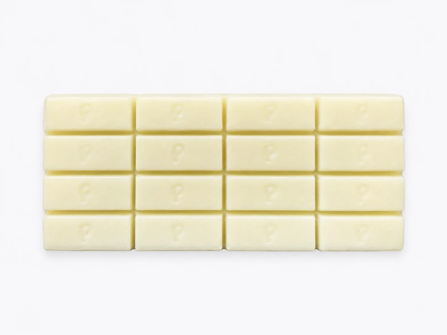 Finished custom white chocolate bar showing branded logo detail