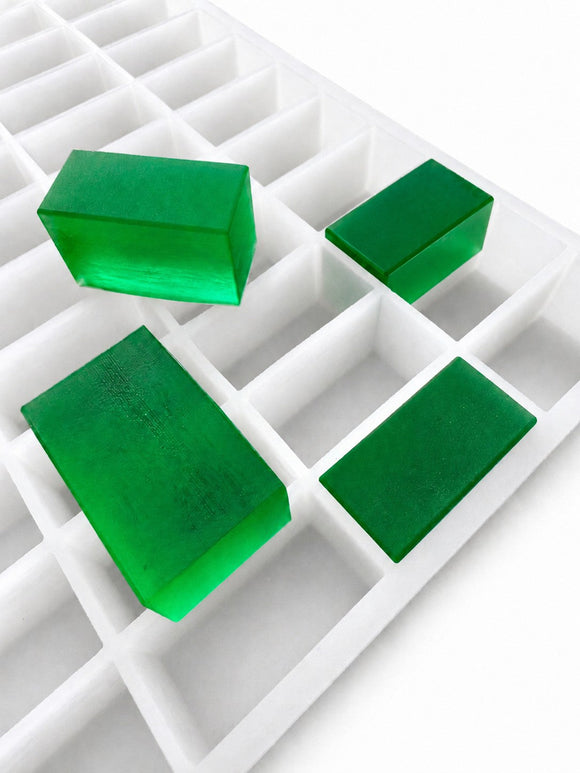 20mL rectangle gummy mold with 119 cavities and emerald green rectangular gummies on a white background