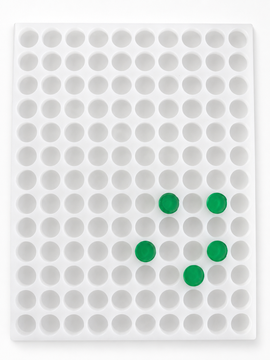 Top view of 3.8mL coin gummy mold with 130 round cavities and green gummies