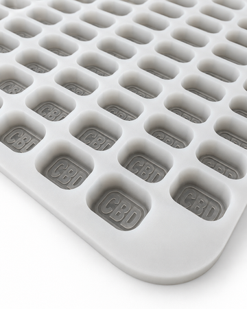 Angled view of 4mL brick gummy mold with 185 embossed cavities