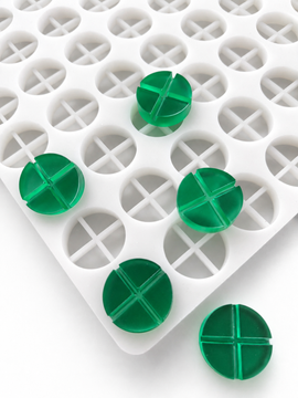 7mL 4-piece disc breaker gummy mold with 70 round segmented cavities and emerald green gummies