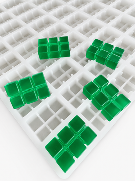 Close-up of 9.35mL 6-piece brick breaker silicone gummy mold with emerald green segmented brick gummies